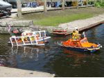The Chandlers' DUKW pulls the trailer and Atlantic class RIB lifeboat into the water.